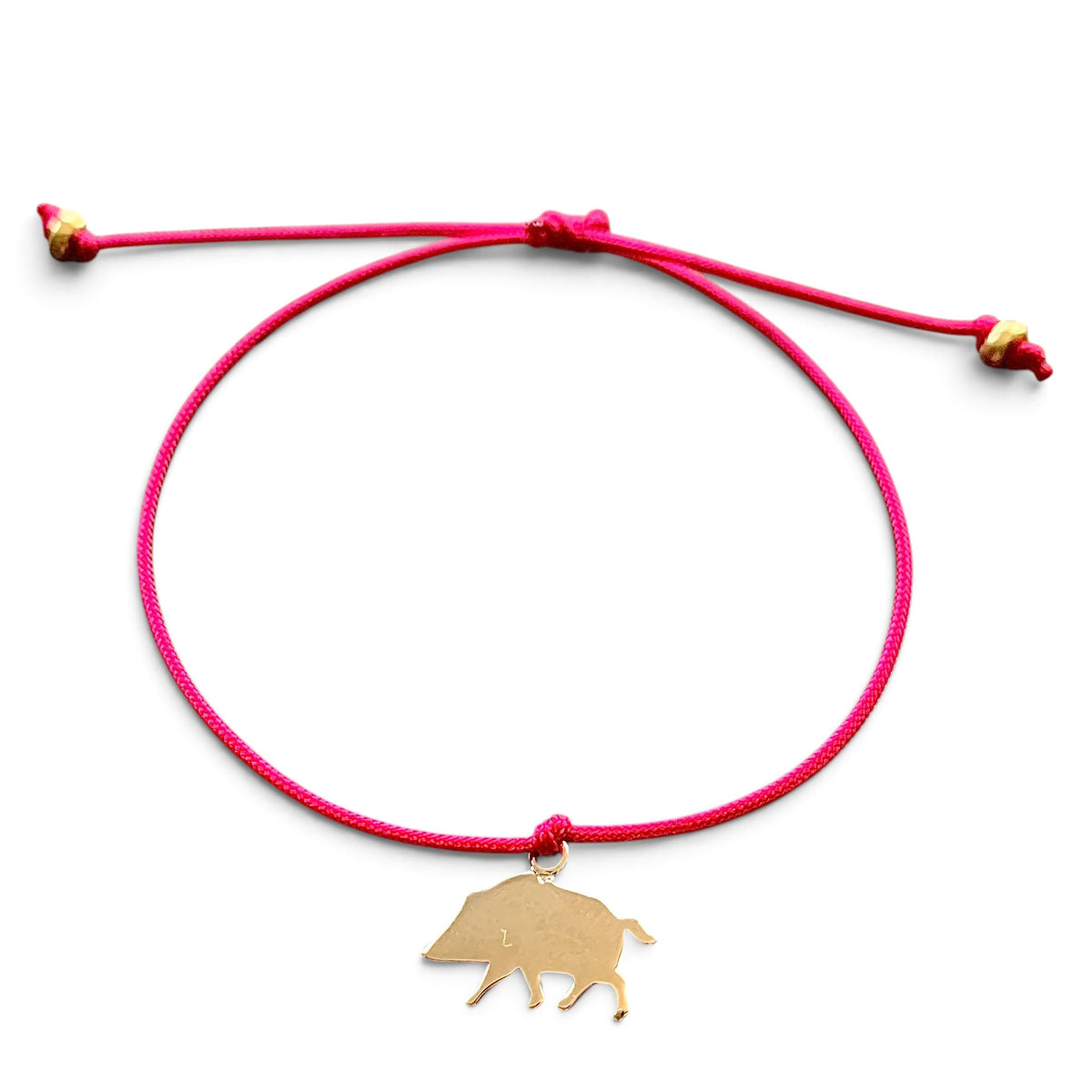 ANNA VON BERGMANN Armband Kleines Glück mit pinker Nylonkordel und goldplattiertem Wildschwein-Anhänger aus Messing