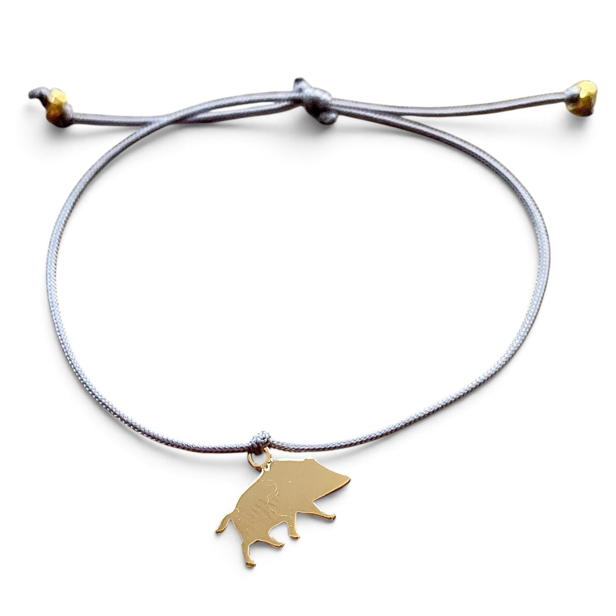 ANNA VON BERGMANN Armband Kleines Glück mit goldenem Wildschwein-Anhänger aus Messing an grauer Nylonkordel