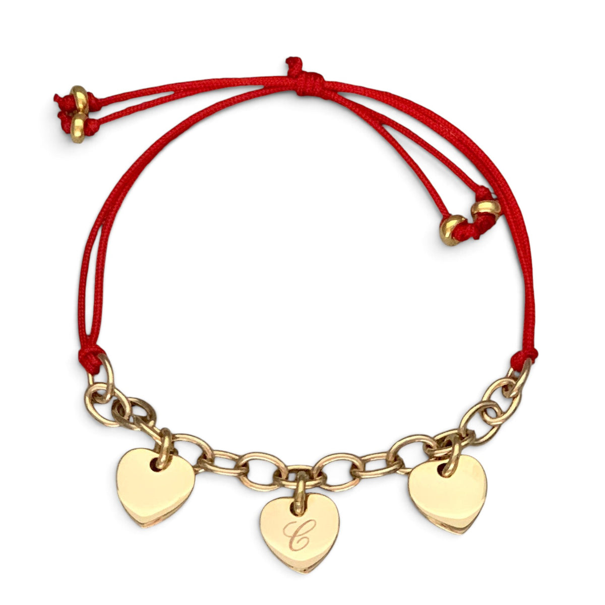 ANNA VON BERGMANN Armband mit drei gravierbaren goldenen Herzanhängern an rotem Nylonband