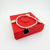 Bicolor Armband mit Gravur und Plättchen in gold und silber